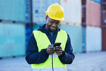 Image showing Social media, logistics and employee working in shipping typing on a mobile app with phone at a port. Happy African warehouse man reading an email or communication on a smartphone at industrial site