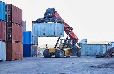 Image showing Logistics, cargo and forklift with container with stock for delivery in an industrial port. Ecommerce worker working with transportation of manufacturing product with a crane at an outdoor warehouse