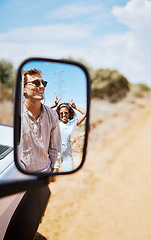Image showing Couple on road trip, smile in car mirror reflection and happy smile with love on desert holiday road trip drive in South Africa. Summer vacation in the wild, diverse male and female friends with fun
