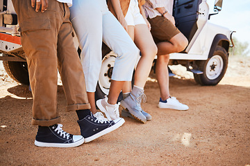 Image showing Travel, shoes and friends bonding in road, standing together on a desert journey and taking a break. Adventure, fun and freedom by group of travellers exploring earth and stop to enjoy view together