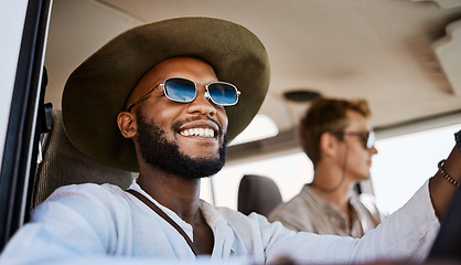 Image showing Happy, smile and black man driving a car while on a summer road trip vacation with friends. Happiness, freedom and young people having fun while traveling in a vehicle to holiday destination together