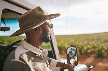 Image showing Travel, road trip and a black man by a car for a holiday motor adventure. Calm and relax person looking at countryside nature taking a break from driving and transport outdoor in the summer sun