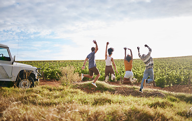 Image showing Jump, freedom and friends in a field in nature while on a summer road trip vacation in the countryside. Group, travel and happy people with energy on a outdoor holiday break in south africa.