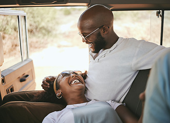 Image showing Road trip, black couple and travel during drive through nature on a summer vacation with a smile, happiness and love. Happy man and woman laughing and bonding on safari journey or trip together