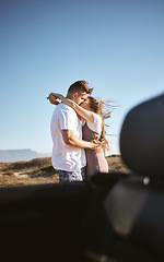 Image showing Road trip, travel and couple kiss and hug for holiday, vacation or outdoor adventure with blue sky mock up advertising or marketing. Love, romantic people with car by countryside road summer mockup