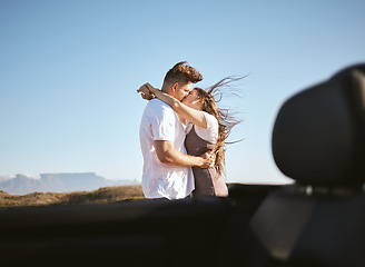 Image showing Couple, love and kiss on nature road trip, vacation or summer holiday outdoors in Canada. Romance, affection and happy man, woman and hug spending quality time together, bonding and kissing by car.