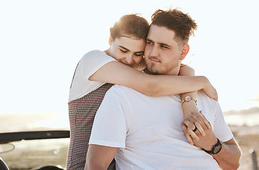 Image showing Real couple hug, road trip and relax at sunset on a romantic driving vacation in Costa Rica together. Happy white man, woman travel the country in a car and holding hands at peace with a smile