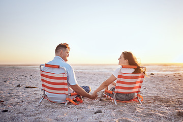 Image showing Love, relax and couple holding hands on the beach for comfort, peace and wellness while on Toronto Canada vacation. Mockup sky, sunset and bonding man and woman enjoy romantic quality time together