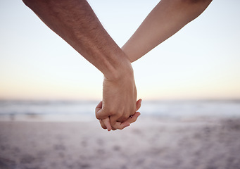 Image showing Love couple holding hands, beach and care together at ocean, nature and summer vacation of save the date in Maldives together. Closeup man, relax woman and support, trust or hope on honeymoon holiday