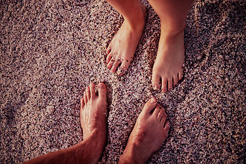 Image showing Couple, feet and beach on wet sand for calm, relax and travel on summer vacation together in nature. Toes of people in relationship on sandy ocean for holiday traveling in the outdoors of Costa Rica