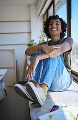 Image showing Young woman, artist and by table with window relax, happy and smile in workshop or studio. Creative black female, lady or designer student content with work and calm in workspace and gallery