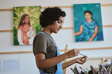 Image showing Creative, art and woman thinking in studio with choice of brush for next painting, artwork or design sketch. Planning, decision and Indian female vision or ideas for drawing inspiration in home.