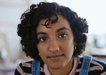 Image showing Face, eyes and portrait with a woman from India closeup inside with curly hair and a serious expression. Head, nosering and piercing with an attractive young female for edgy, trendy or modern style