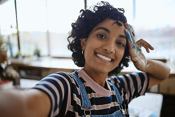 Image showing Selfie, creative woman and painter in studio smile, relax and happy with completed work. Portrait, confident girl and female Indian artist with hand covered in oil paint, watercolor and at workspace.