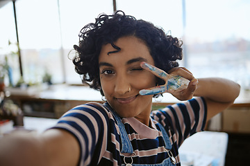 Image showing Selfie, art or creative girl with peace sign from India in studio with smile, happy portrait or hand with paint. Artist, painter or student for artwork design, comic or college girl in workshop photo