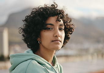 Image showing Portrait of young Indian woman in the city, fashion, beauty and urban background. Face, natural beauty and beautiful girl in town enjoying sunset on rooftop thinking, vision and motivation in life