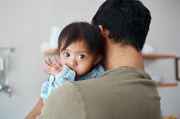 Image showing Love, care and down syndrome baby with father bonding, relax and enjoy cute quality time together in home kitchen. Intellectual disability, child development and family dad holding disabled Asian kid