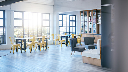 Image showing University, space and study lounge interior design for educational workspace with natural sunlight. Empty and spacious college learning room for studying with literature books collection in bookcase.