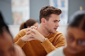 Image showing College, student and study in a university classroom or lecture for education, scholarship and training. Thinking male learning and talking in workshop with group of school students in an academy