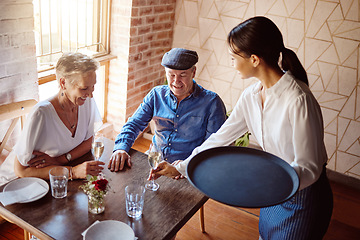 Image showing Restaurant waitress, wine glass and service to happy couple for lunch celebration on fine dining date. Hospitality catering, alcohol champagne glasses and drinks menu order to senior customers table