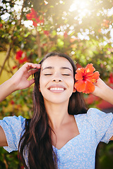 Image showing Girl, tropical flower and garden in summer sunshine on vacation, holiday and spring break in Hawaii. Happiness, wellness and beauty skin care or zen mental health self love, peace, happy and smile.