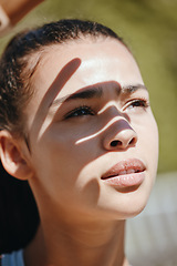 Image showing Face, shadow and woman in sun for outdoor leisure and peaceful summer break for mental wellness. Beautiful young latino girl outside to relax and get fresh air covering eyes from sunlight outdoors