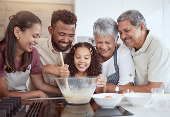 Image showing Baking, family and girl in kitchen for cake with ingredients and food in a bowl with grandparents and parents in their house. Mother, father and senior people with smile learning cooking with kid