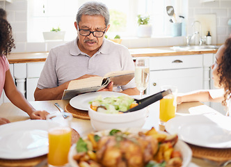 Image showing Food, family and books with grandfather reading to children at a table, bonding and storytelling before sharing a meal. Bible, religion and senior man teaching grandkids faith and scripture in home