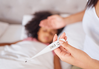 Image showing Thermometer, mother and girl in bed, sick with fever and covid risk in a bedroom, measuring on digital device. Family, flu and hand of concerned parent comfort ill child, worried about corona