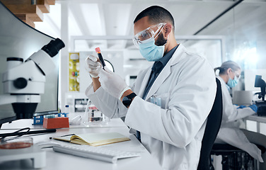 Image showing Man, lab and research in science to study dna of virus with PPE for safety, wellness and health. Doctor, scientist or biologist work as team in laboratory, analysis of data and covid for healthcare