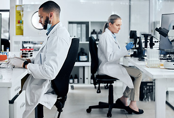 Image showing Science, covid innovation and scientist people working in research biotechnology laboratory. Diversity expert woman and man with corona virus, dna or healthcare project test results and analysis tech