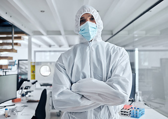 Image showing Covid, safety and portrait of man in hazmat suit to protect against covid 19 pandemic, risk or corona virus. Ppe, face mask and medical healthcare worker, doctor or scientist in science laboratory