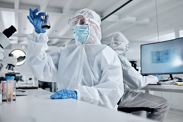 Image showing Blood, covid and doctors in a science laboratory testing dna and rna to research, analysis and analyze the chemistry. Medical scientists in hazmat suit and safety mask working on vaccine innovation