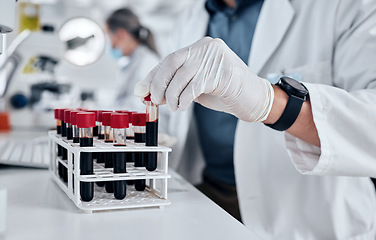 Image showing Scientist, science and dna blood sample test tube in pathology lab with gloves doing research and working on vaccine or medical investigation. Innovation, breakthrough and medicine with hands of man