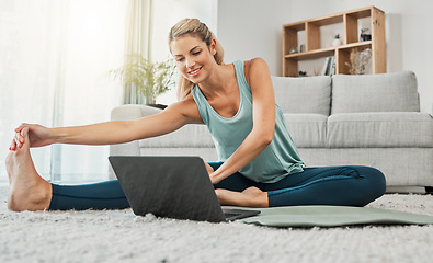 Image showing Yoga, stretching and woman on laptop in home streaming training video, web yoga class or tutorial. Zen, health and young female on tech pc, pilates mat and exercise, fitness and wellness workout.