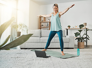 Image showing Fitness woman, yoga and online tutorial or video on laptop with a woman doing exercise, training and workout in lounge at home. Healthy USA woman streaming the internet for health and wellness blog