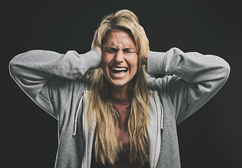 Image showing Stress, screaming or crying woman with hands over ears on black background in studio with mental health, anxiety or schizophrenia. Psychology, depression or shouting patient in counseling help asylum