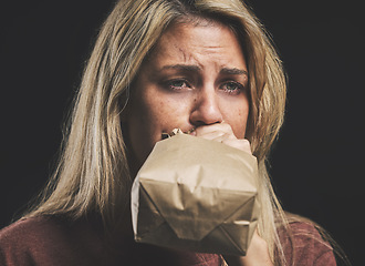Image showing Anxiety, nausea and woman with paper bag for stress and panic attack relief with black mockup. Girl suffering with trauma, psychosis and mental health trouble breath technique for calm mindset.