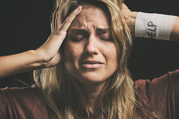 Image showing Mental health, depressed woman and help for drug addiction, suicide thoughts or schizophrenia and crying in dark studio. Bandage, paranoid and rehabilitation for crazy female addict with depression