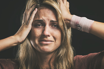 Image showing Suicide, depression and sad with a woman victim of violence in studio on a dark background. Anxiety, mental health and pain with a female thinking of death while suffering from pain, hurt or anger