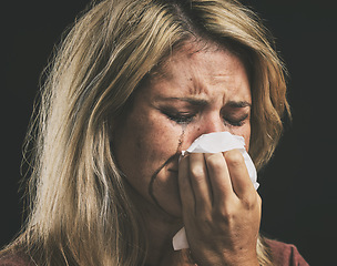 Image showing Woman sad and crying with depression, anxiety and stress against a mockup black studio background. Mental health, frustrated and tired female thinking of abuse, fear and toxic mistake in her life