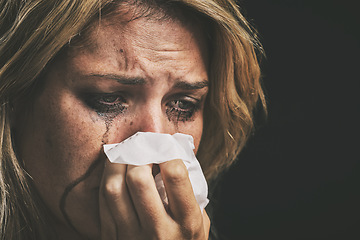 Image showing Crying, depression and woman thinking of mental health problem against a black studio background. Face of a sad, frustrated and depressed person with running makeup, anxiety, stress about divorce