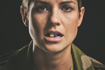 Image showing Medicine, medical drugs and military woman with tablet in mouth for ptsd, depression or anxiety against black studio background. Portrait of a soldier with pills for stress and mental health