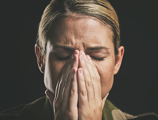 Image showing Crying, depression and sad military soldier with stress from the army against a black studio background. Depressed, frustrated and veteran woman with ptsd trauma, anxiety and mental health problem