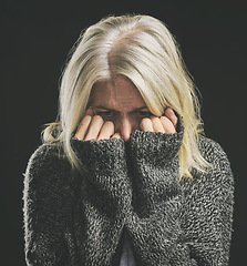 Image showing Fear, mental health and dark depression for woman with social anxiety, scared mindset or personality disorder. Nervous breakdown, psychology or sad senior person with life problem on black background