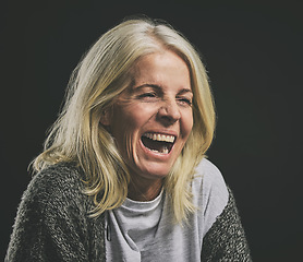 Image showing Mental health, depression and woman with bipolar laughing in dark studio. Lady with schizophrenia, anxiety and mental illness with laugh expression. Mockup in psychology, addiction and rehabilitation