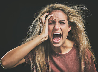 Image showing Face, mental health and screaming woman headache, anxiety or stress. Psychology, bipolar or crazy, insane or depressed schizophrenia female, shouting or hearing voices alone on dark studio background