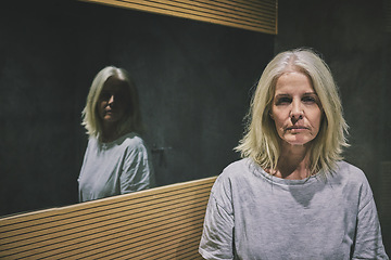 Image showing Mature woman, depression or mental health by bathroom mirror of house, home or hotel. Portrait, stress or anxiety of schizophrenia patient in psychology asylum with imposter syndrome, bipolar or fear