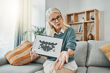 Image showing Inkblot test, therapy and mature psychologist talking about mental health problem with a picture on a sofa in an office. Therapist in communication about evaluation, counseling exam and mind health