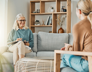 Image showing Woman talking with therapist about depression, anxiety and mental health problems in her life. Psychologist listening with patience, understanding and compassion on couch while writing therapy notes